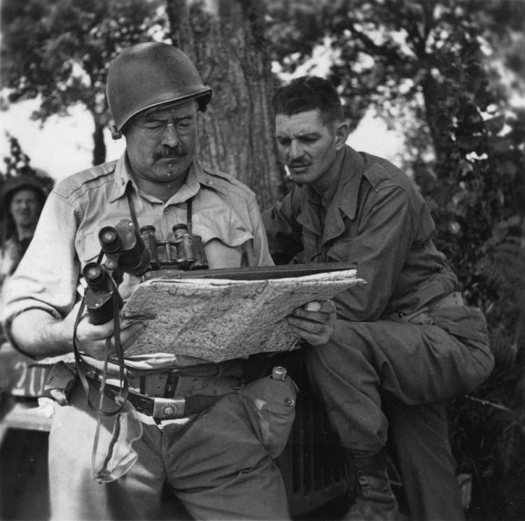 EH6891P 
Ernest Hemingway with soldier looking at a map in World War II.  Photograph coopyright unknown and held in the Ernest Hemingway Collection at the John F. Kennedy Presidential Library and Museum, Boston.