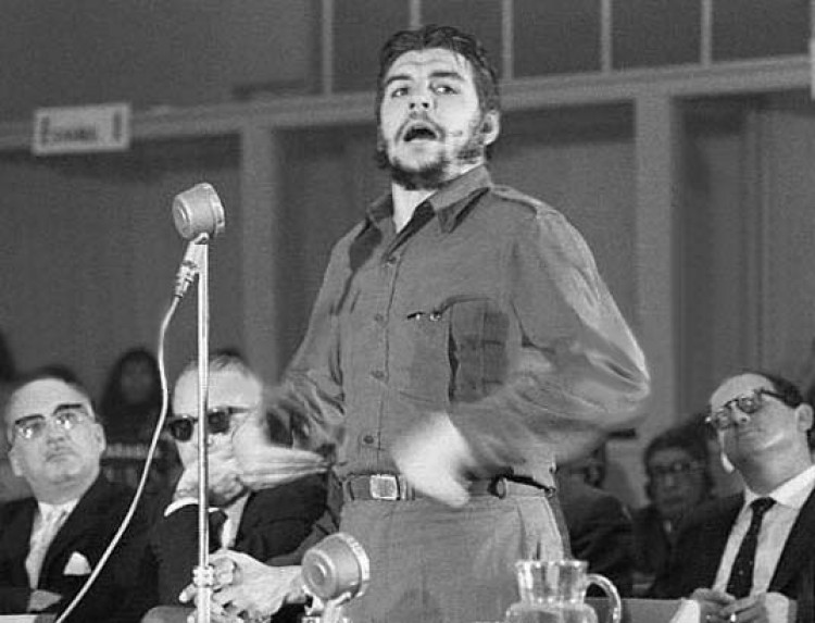Original Caption: Guevara Speaks, Dillon Listens. Punta Del Este, Uruguay: Cuban economic chief Ernesto 
